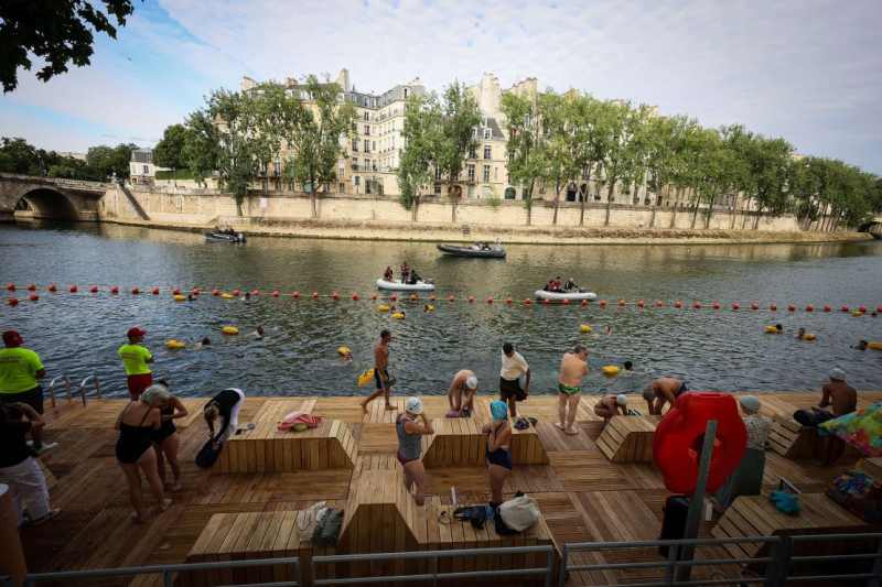 Joyful Parisians take a historic plunge into the Seine after 100 years
